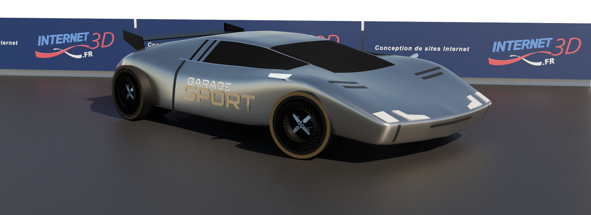 Voiture de sport grise sur un stand de circuit automobile.